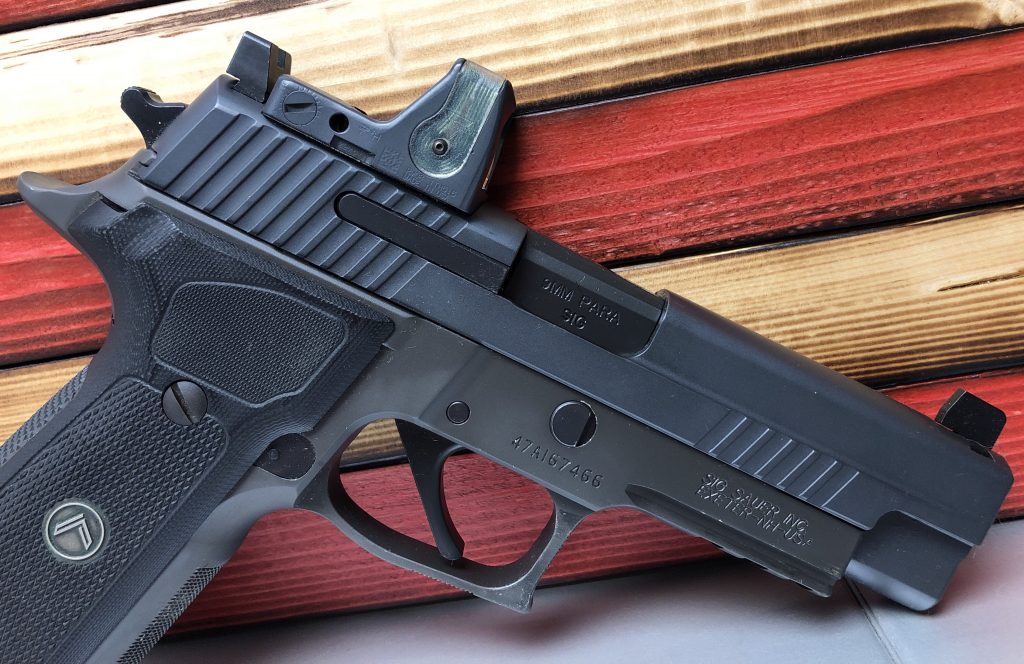 Sig p226 Legion with trijicon RMR and co-witness sights.