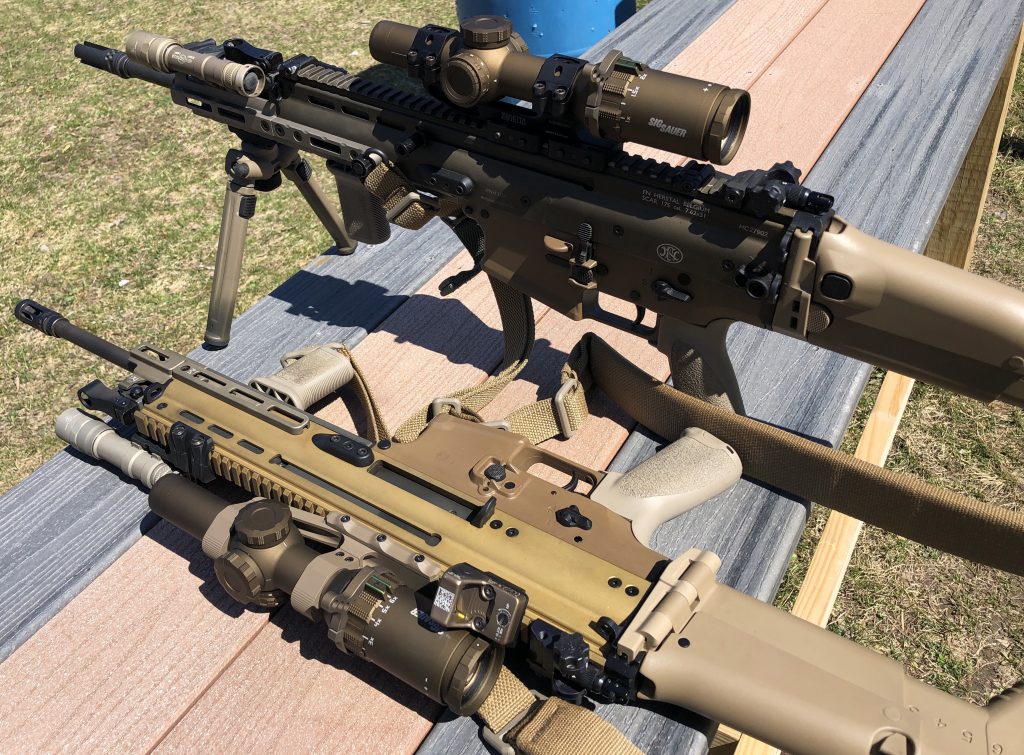 SCAR rifles heavily kitted with optic and rail upgrades