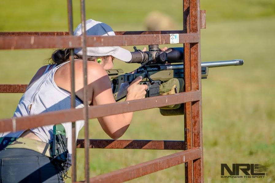 the author stephanie martz using a g-code 9mm mag pouch to retain the kestrel during a long range shooting match