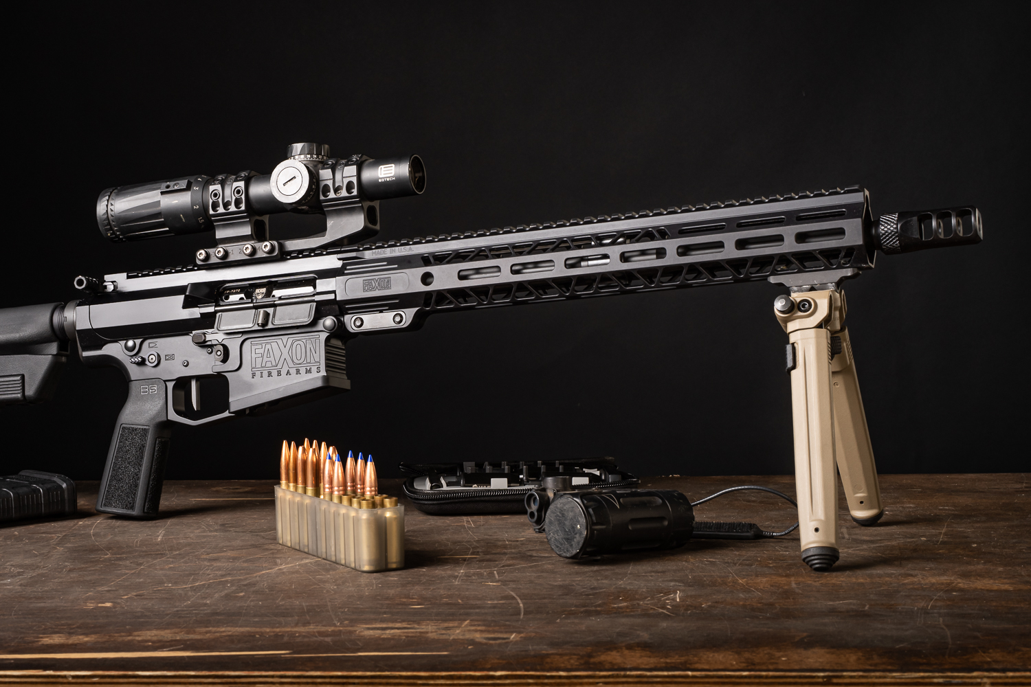 A scoped Faxon Sentinel 16" 8.6 BLK AR-10 Rifle.