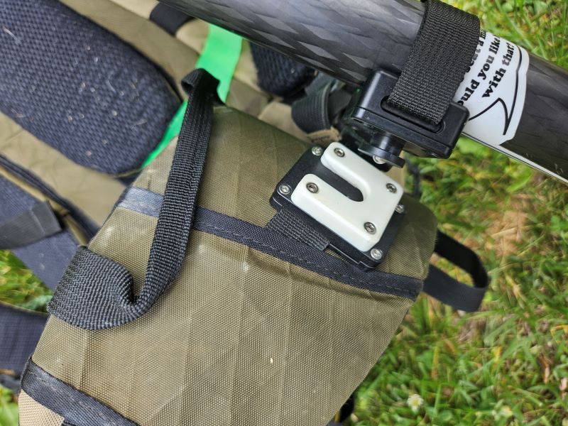 obi link on strap of pack and grip on on tripod