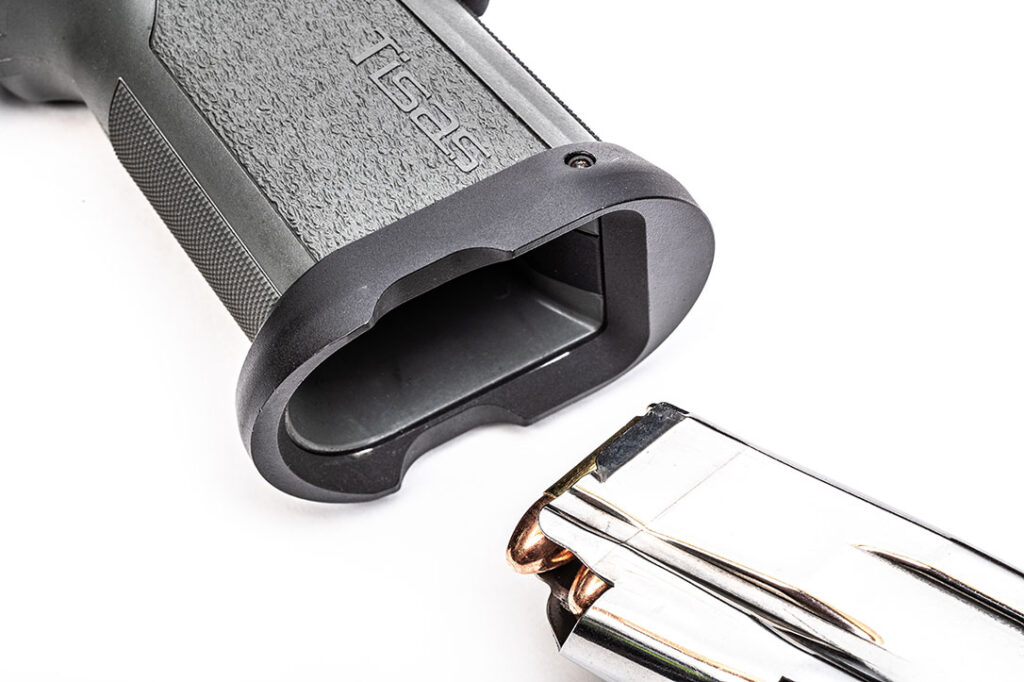 A detachable polymer magazine well funnel is held in place on the gun with the mainspring housing pin and is rock-solid and wobble-free.